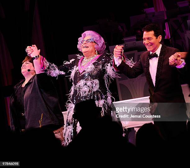 Actors Dame Edna and Michael Feinstein take a bow during curtain call on the opening night of "All About Me" on Broadway at Henry Miller's Theatre on...