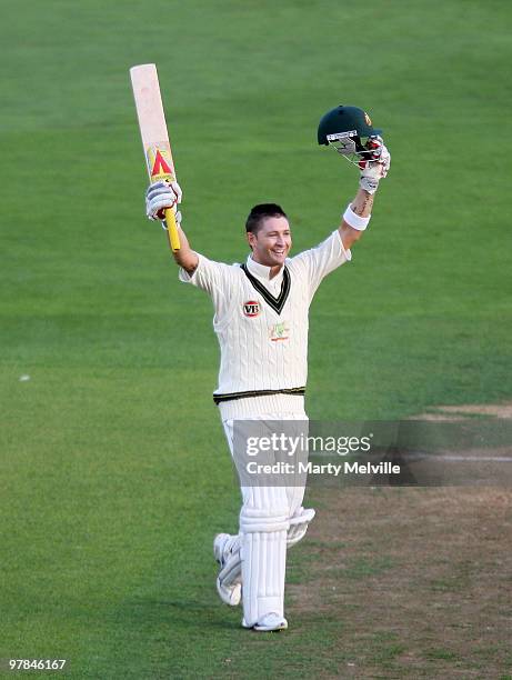 Michael Clarke of Australia celebrates scoring a century during day one of the First Test match between New Zealand and Australia at Westpac Stadium...