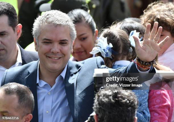 Ivan Duque, presidential candidate for the Centro Democratico party, greets the followers after voting during the presidential ballotage between...