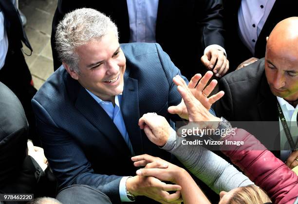 Ivan Duque, presidential candidate for the Centro Democratico party, greets the followers after voting during the presidential ballotage between...