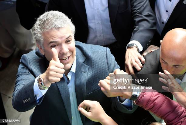 Ivan Duque, presidential candidate for the Centro Democratico party, greets the followers after voting during the presidential ballotage between...