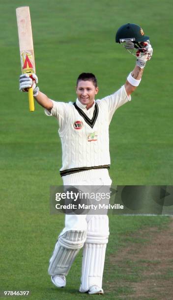 Michael Clarke of Australia celebrates scoring a century during day one of the First Test match between New Zealand and Australia at Westpac Stadium...