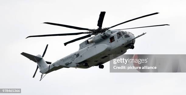 April 2018, Germany, Schoenefeld: The American military helicopter Sikorsky CH-53 King Stallion takes off at the International Aviation Exhibition...