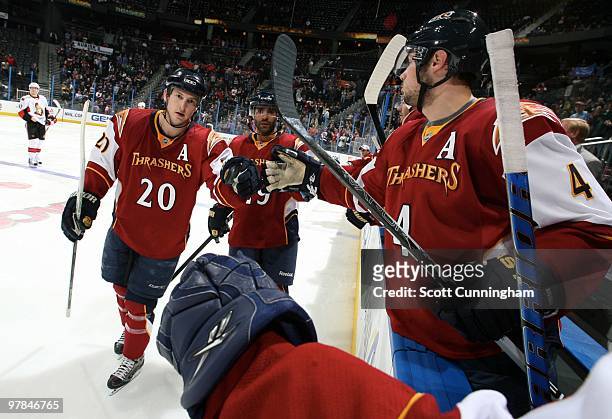 Colby Armstrong of the Atlanta Thrashers is congratulated by teammates after scoring against the Ottawa Senators at Philips Arena on March 18, 2010...