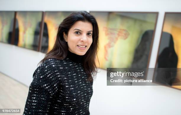 April 2018, Germany, Wolfsburg: Indian artist Reena Saini Kallat standing by her artwork "Crease/Crevice/Contour". The exhibition "Facing India" at...