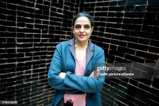 Indian artist Bharti Kher poses in front of her work "The Deaf Room" during the exhibition "Facing India", which tackles the feminine perspective on...