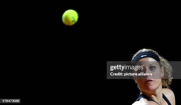 German tennis player Laura Siegemund returns to the American CoCo Vandeweghe during their 2018 Stuttgart Open round of 16 women's singles match...