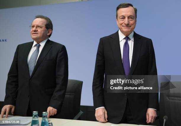 April 2018, Germany, Frankfurt: President of the European Central Bank , Mario Draghi, and his deputy Vitor Constancio taking their seats before the...