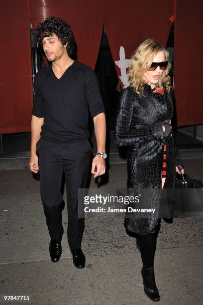Jesus Luz and Madonna are seen leaving Morimoto in the Meatpacking District on March 18, 2010 in New York City.