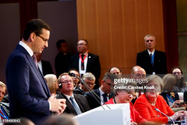 German Chancellor Angela Merkel and German Minister of the Environment Svenja Schulze listen to the speech of Polish Prime Minister Mateusz...