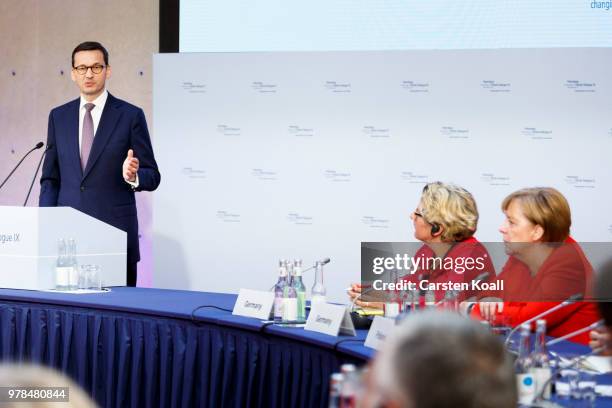 German Chancellor Angela Merkel and German Minister of the Environment Svenja Schulze listen to the speech of Polish Prime Minister Mateusz...