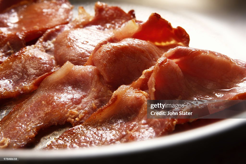 Close-up of bacon cooking in pan