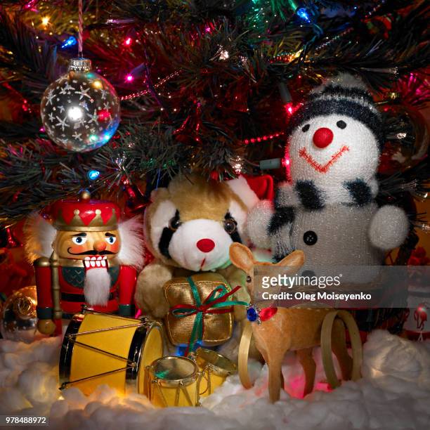 toys under the christmas tree - christmas presents under tree stock pictures, royalty-free photos & images