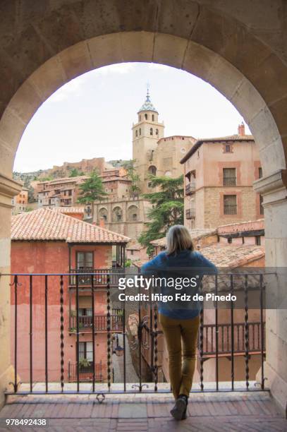 a tourist admires the view of albarracin - teruel province - aragon - spain. - provinz toledo stock-fotos und bilder