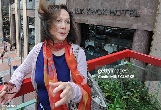 Actress Nancy Kwan speaks outside the re-built Luk Kwok hotel, a former waterfront location where she filmed the movie 'The World of Suzy Wong', in...