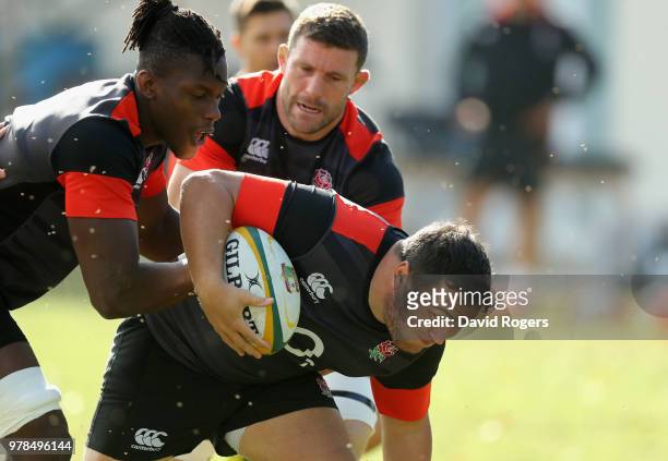 Jamie George charges upfield with Maro Itoje and Mark Wilson in support during the England training session held at Kings Park on June 19, 2018 in...