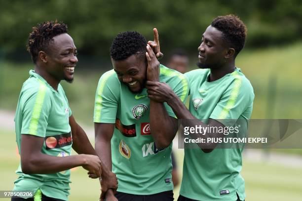 Nigeria's forward Ahmed Musa, defender Chidozie Awaziem and midfielder Onyinye Ndidi attend a training session at Essentuki Arena, southern Russia,...