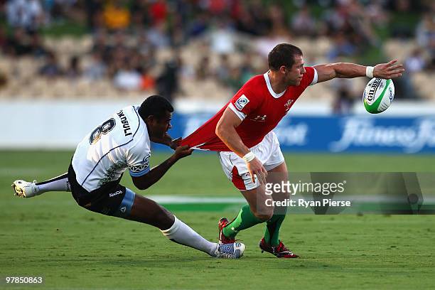 Niumaia Rokobuli of Fiji tackles Ifan Evans of Wales during the match between Wales and Fiji during day one of the IRB Adelaide International Rugby...