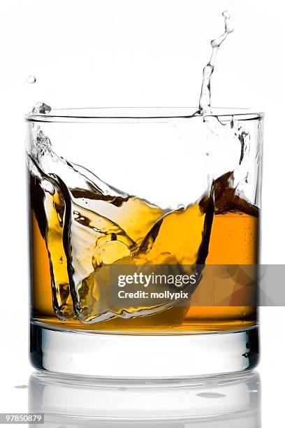 ice in a glass of whisky - mollypix stock pictures, royalty-free photos & images