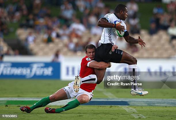 Watisoni Votu of Fiji is tackled by Ifan Evans of Wales during the match between Wales and Fiji during day one of the IRB Adelaide International...