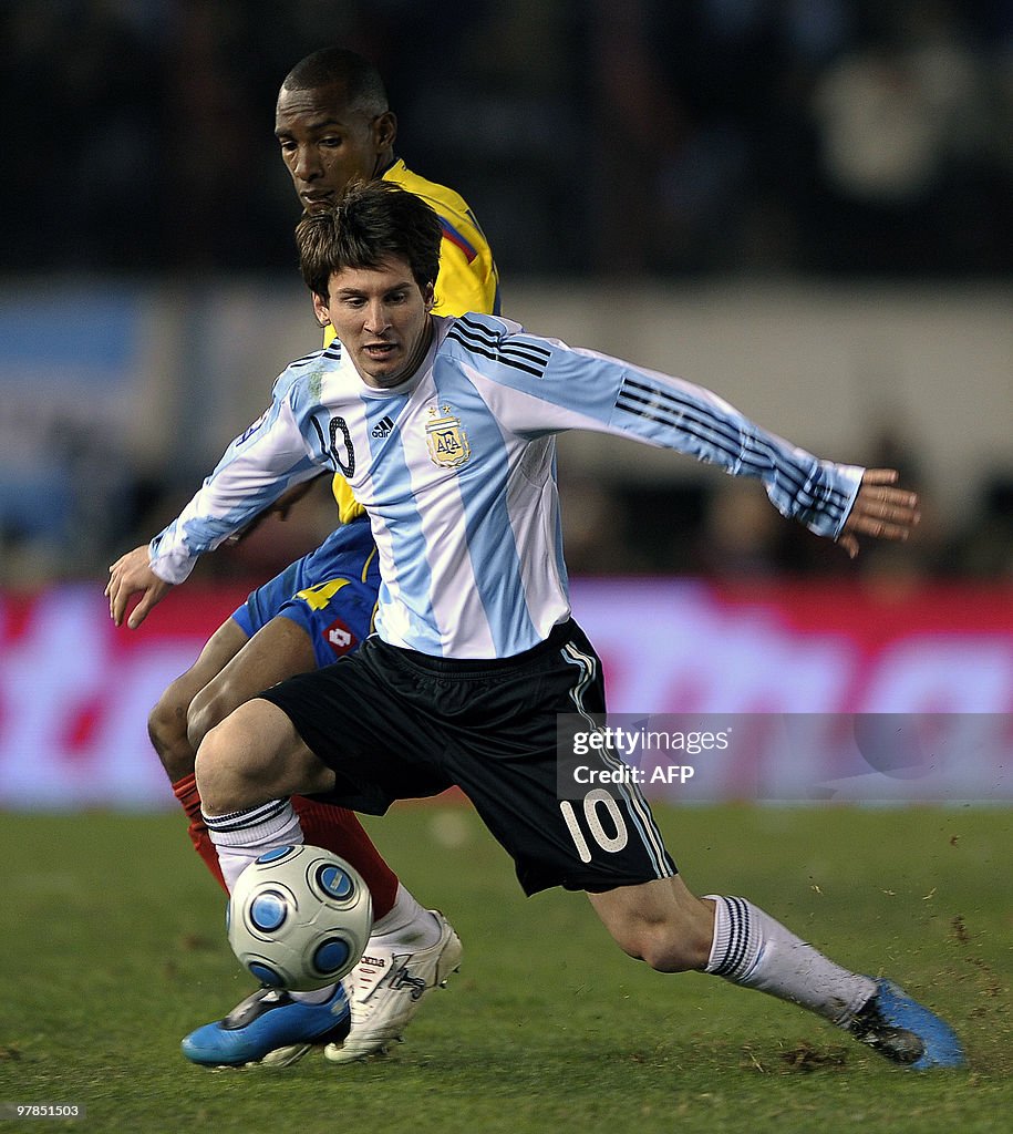 Argentina's forward Lionel Messi controls the ball past defender Luis ...