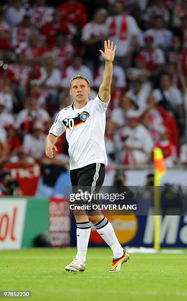 German forward Lukas Podolski celebrates after scoring during the Euro 2008 Championships Group B football match Germany vs. Poland on June 8, 2008...