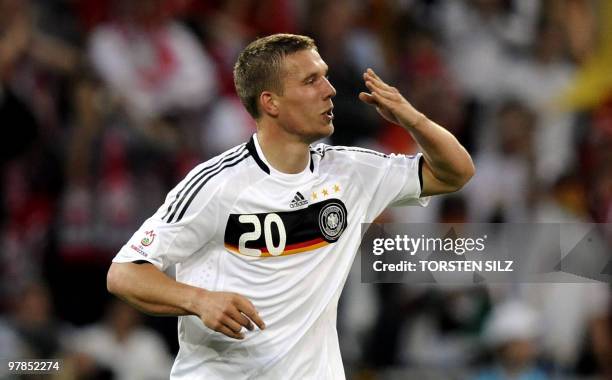 German forward Lukas Podolski celebrates after scoring the 1-0 during their Euro 2008 Championships Group B football match against Poland on June 8,...
