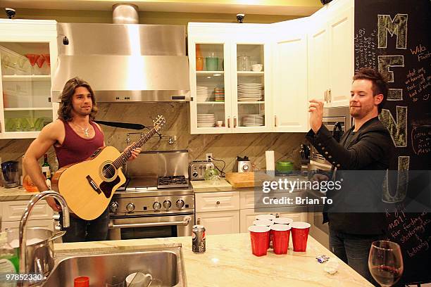 David Cook and Justin Gaston pose at the "If I Can Dream" house on March 18, 2010 in Los Angeles, California.