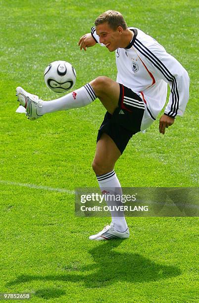 Germany's Lukas Podolski warms up with the ballduring a training session of the national football team at the Stade de Geneve in Geneva 23 May 2006....