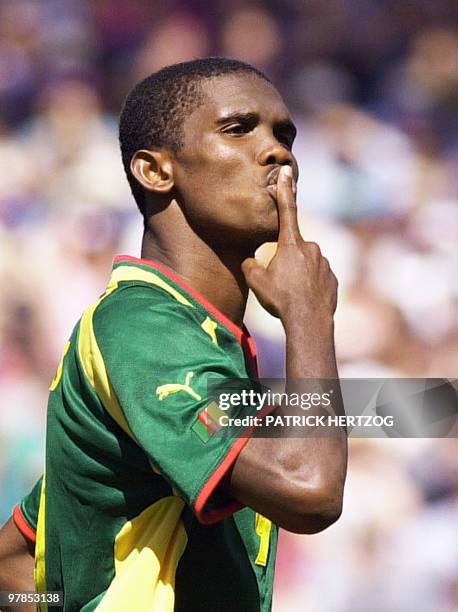Cameroon's forward Samuel Eto'o Fils jubilates after scoring the 2nd goal of his team 30 September 2000 at the Sydney Olympic stadium during the...