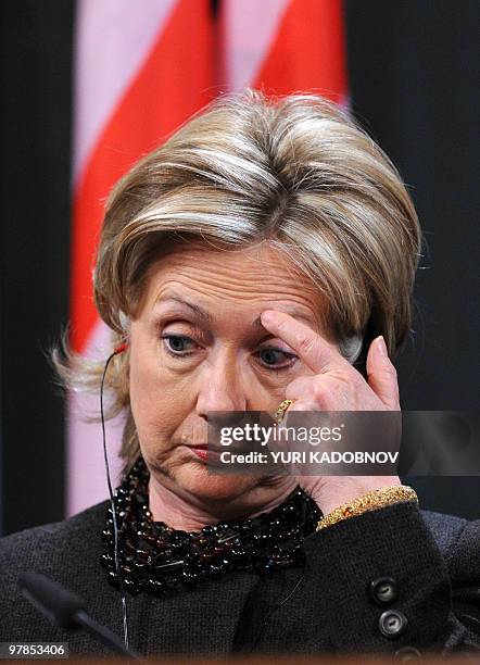 Secretary of State Hillary Clinton, rubs her brow during a press conference after Middle East Quartet talks in Moscow on March 19, 2010. The...