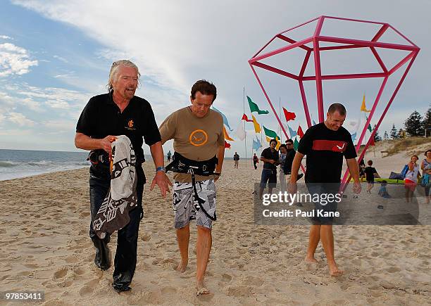Sir Richard Branson walks up Cottesloe Beach after arriving by kite surfer ahead of an afternoon function at Indiana Tea House, as part of a series...
