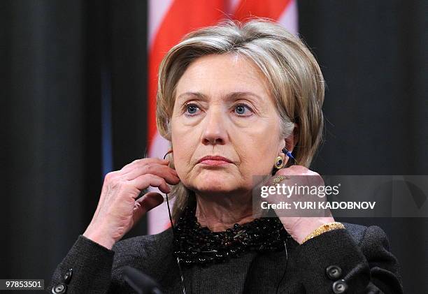 Secretary of State Hillary Clinton listens to a translation during a press conference after Middle East Quartet talks in Moscow on March 19, 2010....