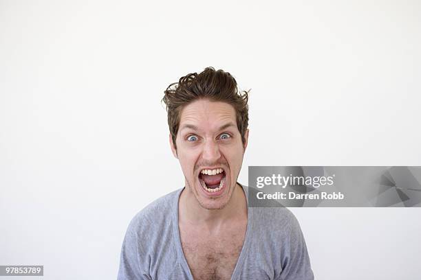 young man screaming - scream stock-fotos und bilder