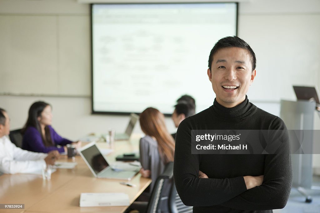 Businessman's portrait under meeting