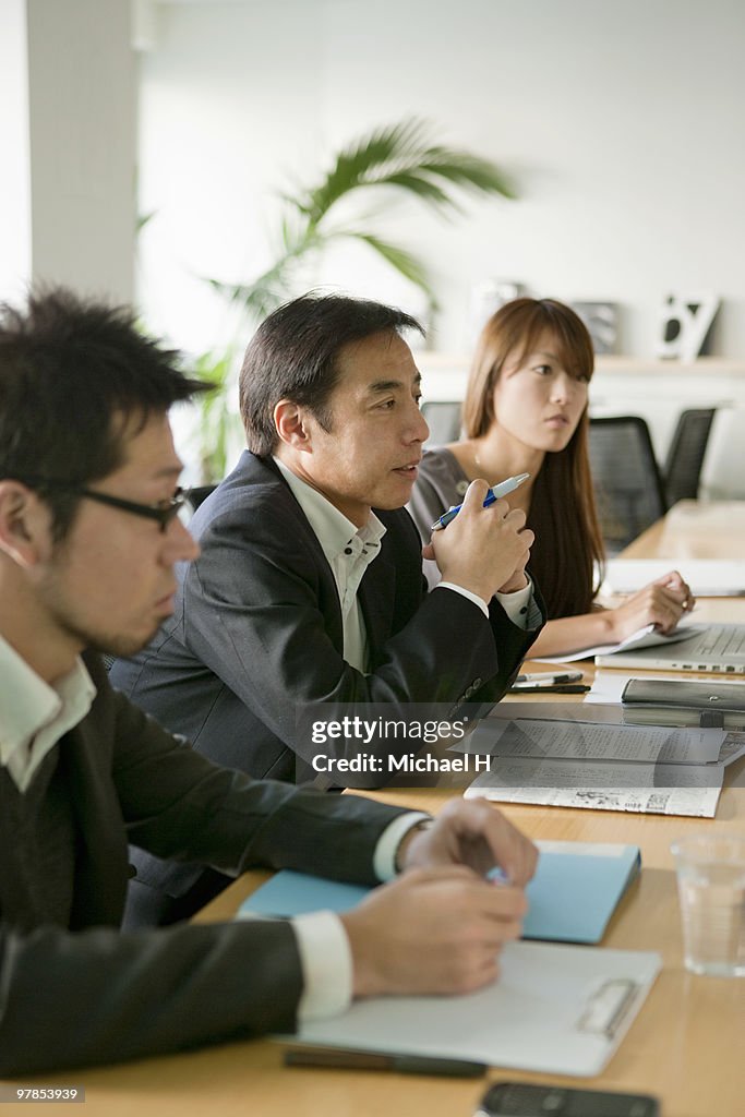 Businessmen who hold a meeting