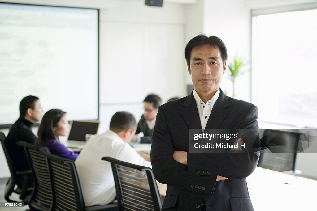 Businessman's portrait under meeting