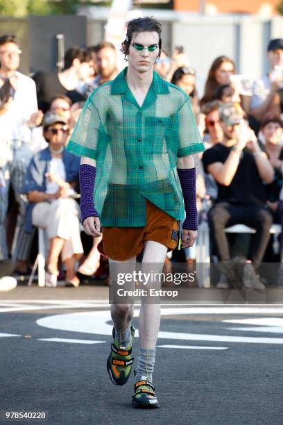 Model walks the runway at the Palm Angels show during Milan Men's Fashion Week Spring/Summer 2019 on June 17, 2018 in Milan, Italy.