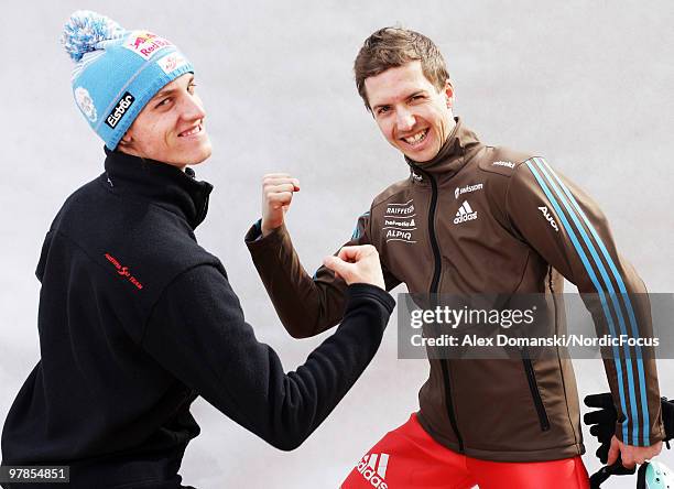 Gregor Schlierenzauer of Austria and Simon Ammann of Switzerland pose for photos during the individual event of the Ski jumping World Championships...
