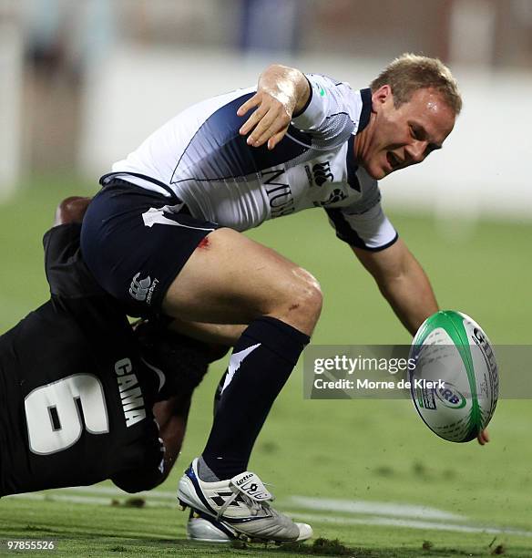 Andrew Turnbull of Scotland is tackled during day one of the IRB Adelaide International Rugby Sevens match between New Zealand and Scotland at...