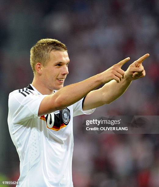 German forward Lukas Podolski celebrates after scoring a second goal during the Euro 2008 Championships Group B football match Germany vs. Poland on...