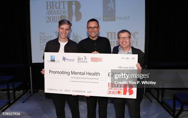 George Ezra, BRITs Chairman, Sony Music UK Chairman and CEO Jason Iley and Mind CEO Paul Farmer pose for a photograph during a the presentation of a...
