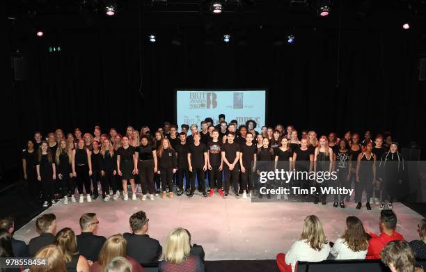 Brit School Choir singing prior to the presentation of a cheque for £250,000 from the Brit Awards to The Brit School, Mind and Music Support at The...