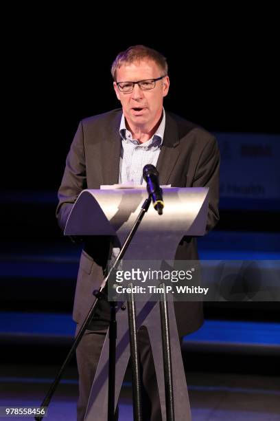 Mind CEO Paul Farmer addresses the audience prior to the presentation of a cheque for £250,000 from the Brit Awards to The Brit School, Mind and...
