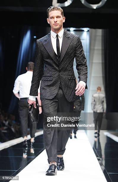 Model walks the runway during the Dolce & Gabbana show as part of Milan Menswear Fashion Week Spring/Summer 2010 on June 20, 2009 in Milan, Italy.