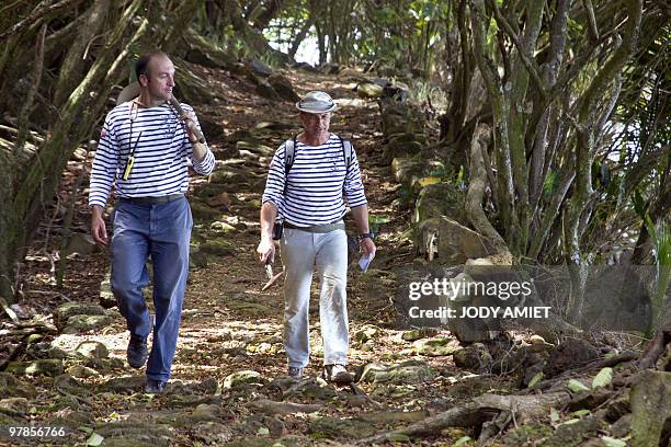 French geologist Eric Gilli walks as he examines rocks to find trail of a possible tsunami in 1855 in the Iles du Salut in French Guiana, about 10...