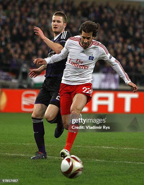 Ruud van Nistelrooy of Hamburg and Ondrej Mazuch of Anderlecht in action during the UEFA Europa League round of 16 second leg match between RSC...