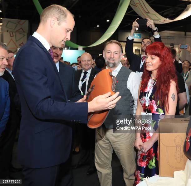 Prince William, The Duke Of Cambridge is presented with handmade gifts for his three children during a visit to the 2018 International Business...
