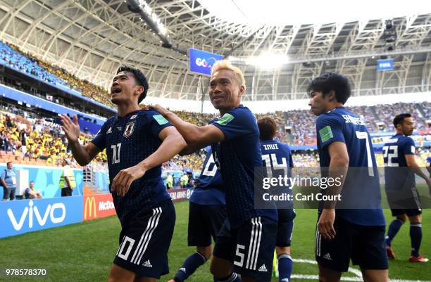 Shinji Kagawa of Japan celebrates with teammates after scoring a penalty for his team's first goal during the 2018 FIFA World Cup Russia group H...