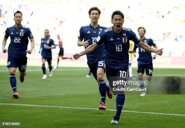 Shinji Kagawa of Japan celebrates after scoring a penalty for his team's first goal during the 2018 FIFA World Cup Russia group H match between...